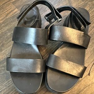 Cole Hahn Grand OS black sandals.